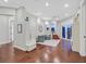 Bright living room with hardwood floors, neutral decor, and access to outdoor spaces through glass doors at 1809 White Hawk Ct, Las Vegas, NV 89134