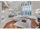 Living room boasts a wall of windows, fireplace, and open access to the dining area at 1809 White Hawk Ct, Las Vegas, NV 89134