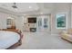 Inviting main bedroom with a fireplace, ensuite, and door to patio at 1809 White Hawk Ct, Las Vegas, NV 89134