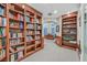 Spacious office featuring custom wood bookcases, a fireplace, and views of the backyard at 1809 White Hawk Ct, Las Vegas, NV 89134