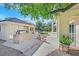 Built-in outdoor grill with stone accents beside a patio and beautiful landscaping at 1809 White Hawk Ct, Las Vegas, NV 89134