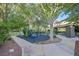 Community playground with a covered picnic area, play equipment, and mature trees at 1809 White Hawk Ct, Las Vegas, NV 89134