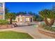 Backyard pool and poolhouse surrounded by mature landscaping, creating a private and serene outdoor oasis at 1809 White Hawk Ct, Las Vegas, NV 89134