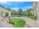 Beautifully landscaped backyard featuring a large pool with spa, mature trees, and meticulous landscaping at 1809 White Hawk Ct, Las Vegas, NV 89134