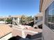Community view featuring walkways, well-maintained landscaping, and multi-story condo buildings with red tile roofs at 1881 W Alexander Rd # 2129, North Las Vegas, NV 89032