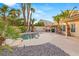 Stunning backyard pool with tropical landscaping and rock accents for a private oasis at 1913 Madagascar Ln, Las Vegas, NV 89117
