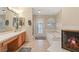 A full bathroom with tile flooring, a bathtub, and an outdoor door at 1913 Madagascar Ln, Las Vegas, NV 89117