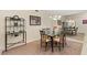 Dining room with a glass table set on a carpeted floor with natural light at 1913 Madagascar Ln, Las Vegas, NV 89117