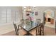 Dining room with a view to the kitchen, an archway, and natural light at 1913 Madagascar Ln, Las Vegas, NV 89117