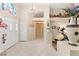Bright foyer with tile flooring, a decorative vase, and an exercise machine at 1913 Madagascar Ln, Las Vegas, NV 89117