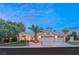 Charming single-story home with desert landscaping, a two-car garage and a tile roof at 1913 Madagascar Ln, Las Vegas, NV 89117