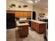 Spacious kitchen with an island, white countertops, and wood cabinets offering ample space at 1913 Madagascar Ln, Las Vegas, NV 89117