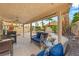 Backyard patio with comfortable seating and a ceiling fan for warmer months at 1913 Madagascar Ln, Las Vegas, NV 89117