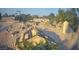 Overhead view of clay tile roof under construction, surrounded by trees at 1913 Madagascar Ln, Las Vegas, NV 89117