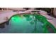 Beautiful swimming pool and spa with LED lighting and stone accents for a luxurious experience at 1913 Madagascar Ln, Las Vegas, NV 89117