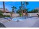 Lush backyard featuring a lagoon-style pool, mature landscaping, with a spa at 1913 Madagascar Ln, Las Vegas, NV 89117