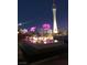 Outdoor lounge with fire pit, cozy seating, and decorative lit trees, perfect for nighttime gatherings at 200 W Sahara Ave # 3510, Las Vegas, NV 89102