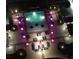 Aerial view of pool area, lit with night lights, and lounge seating and tables for relaxing at 200 W Sahara Ave # 3510, Las Vegas, NV 89102