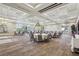 Spacious banquet hall with elegant lighting, tables, and chairs, ready for special occasions and events at 209 Bellini Peak Ave, Henderson, NV 89011