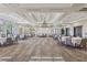 Bright banquet hall featuring large windows, stylish tables and chairs, and a modern chandelier at 209 Bellini Peak Ave, Henderson, NV 89011
