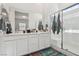 Bathroom featuring double sinks, a shower, and ample counter space at 209 Bellini Peak Ave, Henderson, NV 89011