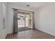 Bedroom with hardwood floors and sliding glass doors to the patio at 209 Bellini Peak Ave, Henderson, NV 89011