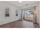 Bedroom with sliding glass doors and wood flooring at 209 Bellini Peak Ave, Henderson, NV 89011