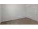 A bedroom with carpeted floors and a closet at 209 Bellini Peak Ave, Henderson, NV 89011