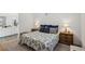 Cozy bedroom featuring a comfortable bed, carpet flooring, and a view of the bathroom at 209 Bellini Peak Ave, Henderson, NV 89011