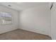 Neutral bedroom with carpet, a window, and a closet at 209 Bellini Peak Ave, Henderson, NV 89011