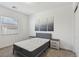 Bedroom featuring a large window for natural light and simple decor at 209 Bellini Peak Ave, Henderson, NV 89011