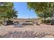 Community area features an outdoor brick patio with comfortable seating around a fire pit at 209 Bellini Peak Ave, Henderson, NV 89011
