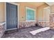 Inviting front entrance featuring a modern door, stylish brickwork, and a 'Welcome' mat at 209 Bellini Peak Ave, Henderson, NV 89011