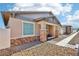 Charming single-story home featuring stone accents, a covered porch, and low maintenance landscaping at 209 Bellini Peak Ave, Henderson, NV 89011