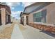 View of a charming single-story home featuring stone accents and low maintenance landscaping at 209 Bellini Peak Ave, Henderson, NV 89011
