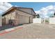 Spacious two-car garage with brick-paved driveway and gated access at 209 Bellini Peak Ave, Henderson, NV 89011