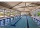 Bright indoor pool with clear water, ample natural light, and comfortable seating areas at 209 Bellini Peak Ave, Henderson, NV 89011