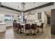 Modern kitchen features a central island with bar seating, stainless steel appliances and herringbone backsplash at 209 Bellini Peak Ave, Henderson, NV 89011