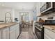 Beautiful kitchen showcasing granite countertops and stainless steel appliances at 209 Bellini Peak Ave, Henderson, NV 89011