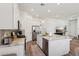 Modern kitchen featuring granite counters, stainless appliances, and open floor plan at 209 Bellini Peak Ave, Henderson, NV 89011