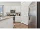 Stylish kitchen featuring stainless steel appliances, granite countertops, and white cabinets at 209 Bellini Peak Ave, Henderson, NV 89011