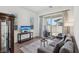 Cozy living room area with access to an outdoor patio and comfortable seating at 209 Bellini Peak Ave, Henderson, NV 89011