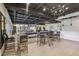 Versatile meeting room with tables, chairs, bar, and game area, perfect for both work and play at 209 Bellini Peak Ave, Henderson, NV 89011