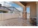 Back patio featuring exposed beams and a brick laid floor, creating a comfortable space for outdoor gatherings at 209 Bellini Peak Ave, Henderson, NV 89011