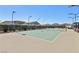 Well-maintained tennis court with professional surfacing, lighting, and surrounding landscaping at 209 Bellini Peak Ave, Henderson, NV 89011