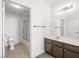Bright bathroom featuring a shower-tub combo and a brown vanity with a white countertop at 231 W Horizon Ridge Pkwy # 212, Henderson, NV 89012