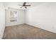 Bright bedroom with neutral carpet and a ceiling fan at 231 W Horizon Ridge Pkwy # 212, Henderson, NV 89012