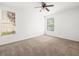 Bright bedroom with neutral carpet and a ceiling fan at 231 W Horizon Ridge Pkwy # 212, Henderson, NV 89012