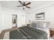 Bright bedroom featuring a ceiling fan, closet, and neutral decor at 231 W Horizon Ridge Pkwy # 212, Henderson, NV 89012