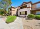 Exterior of the two-story building with greenery, sidewalk, and stairway to upper-level units at 231 W Horizon Ridge Pkwy # 212, Henderson, NV 89012